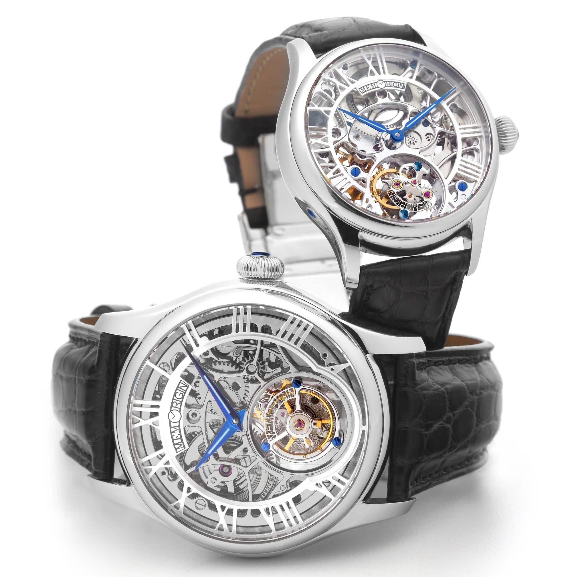 Two black wristwatches with transparent faces on a white background