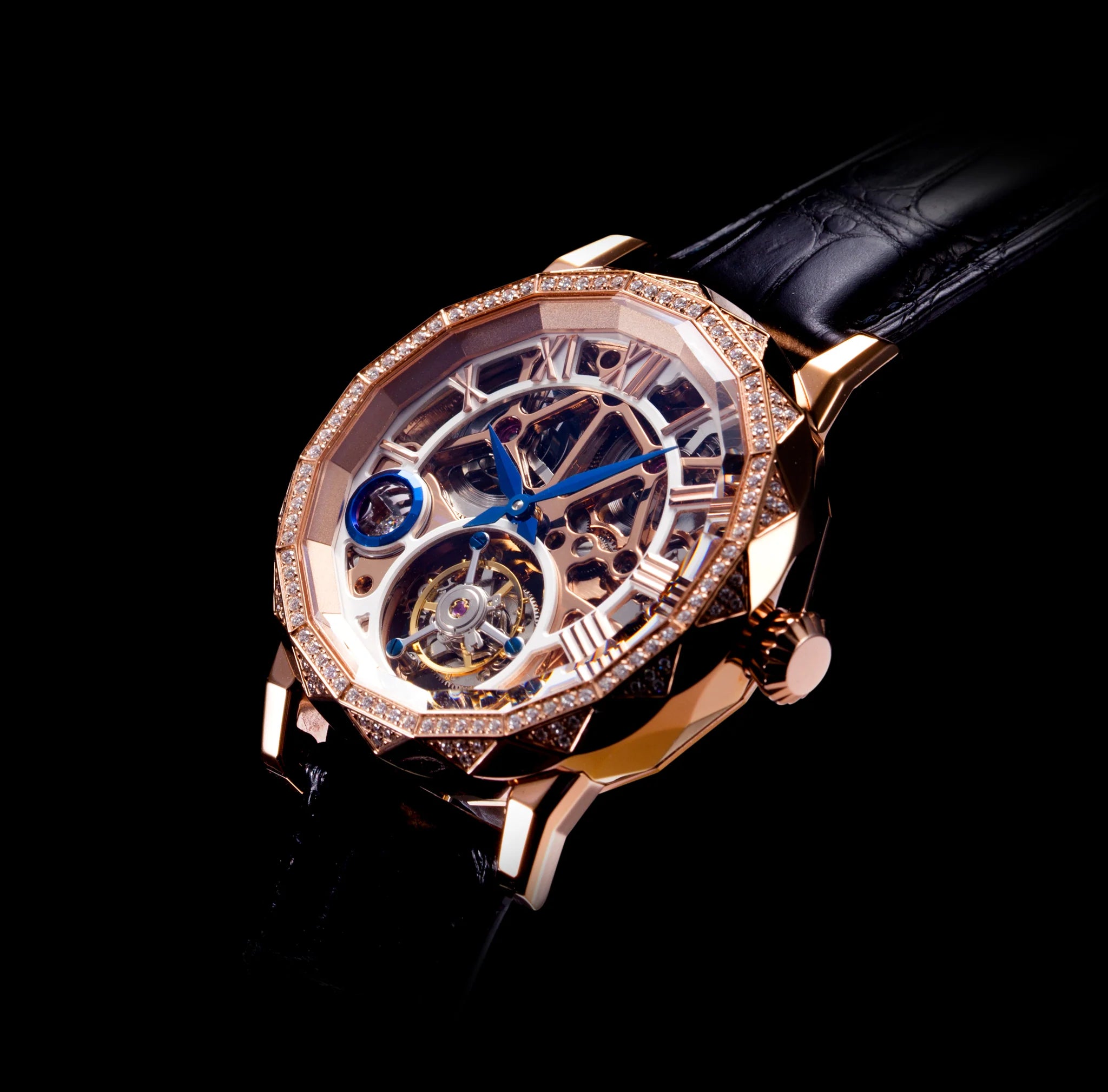 Luxury watch with rose gold case and black strap on a dark background
