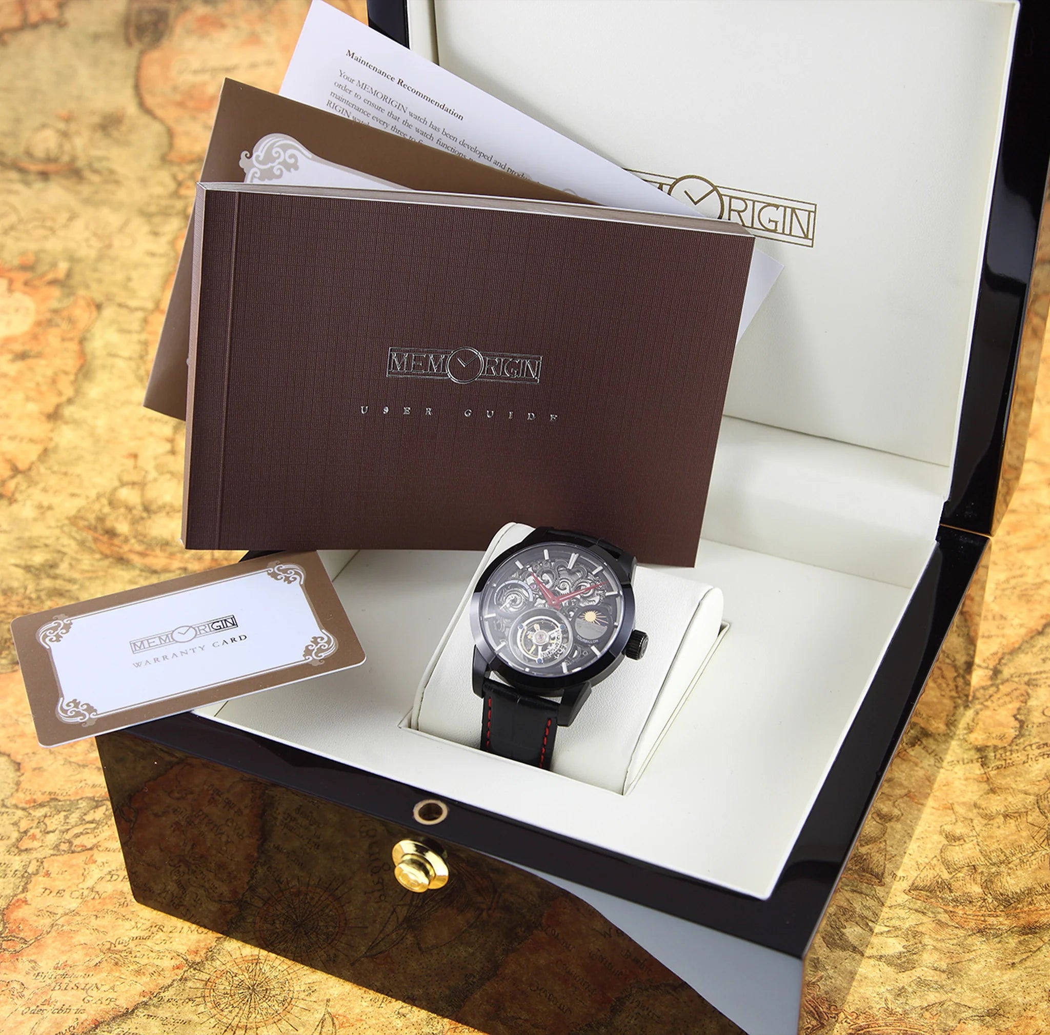 Luxury watch in a branded box on a map background