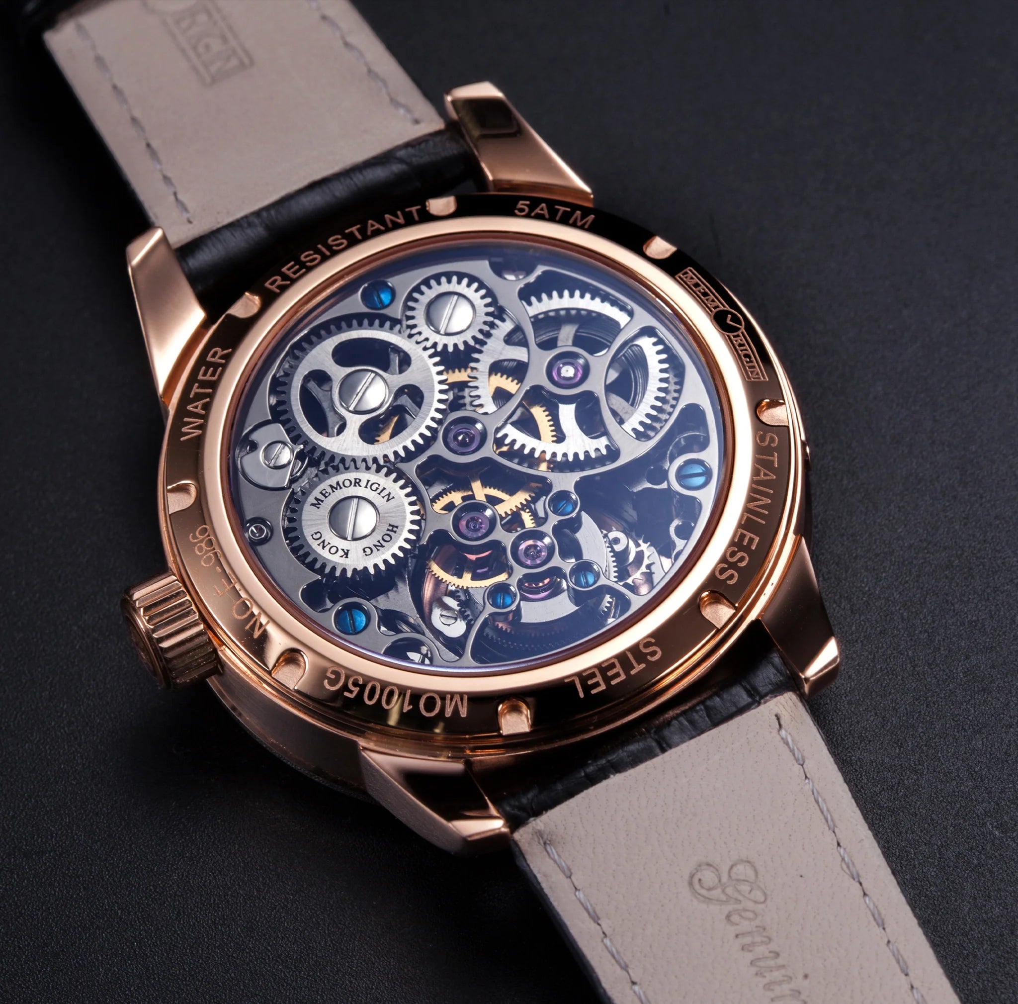 Luxury watch with mechanical components on a dark background