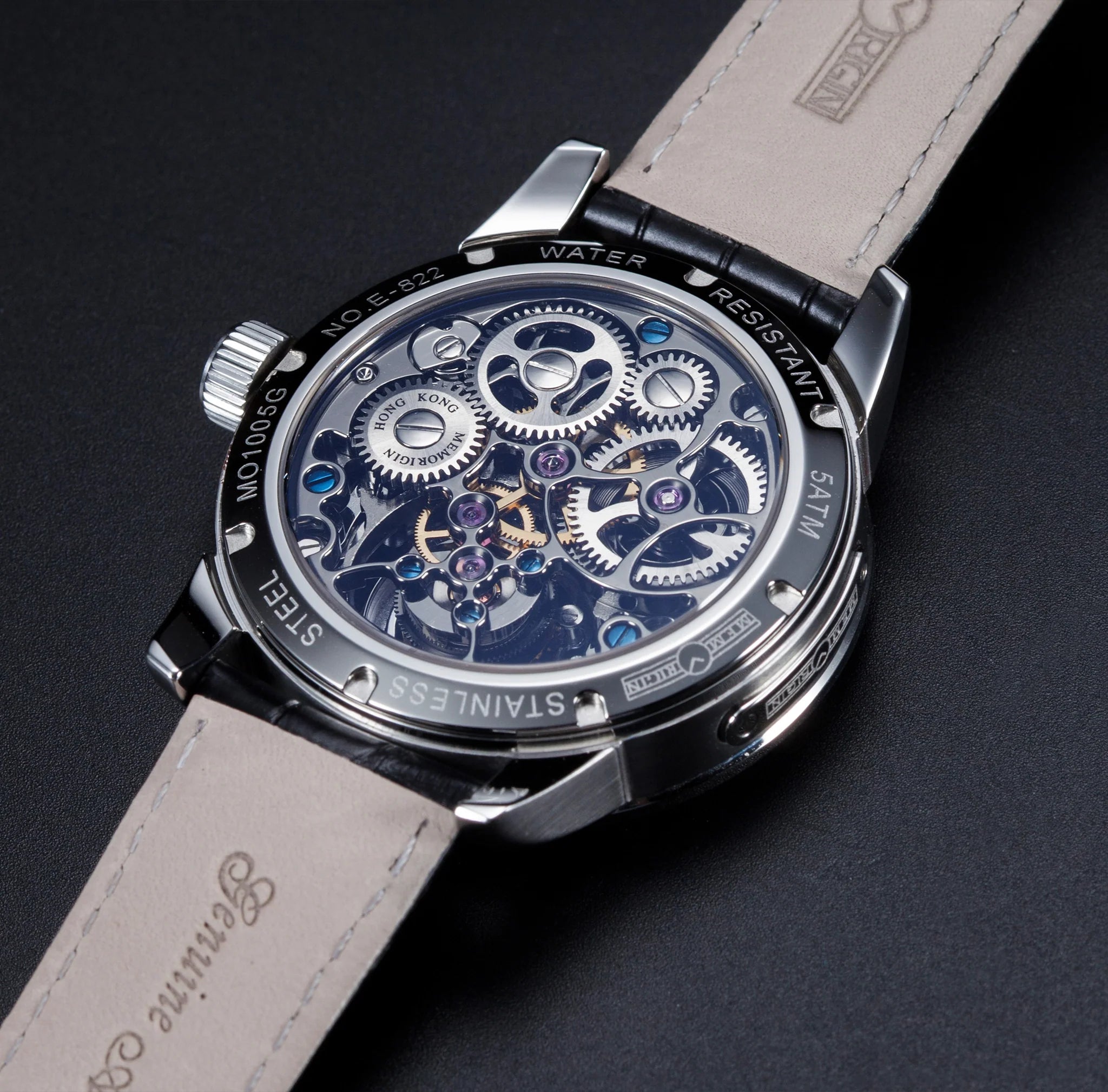 Luxury watch with mechanical components on a dark background
