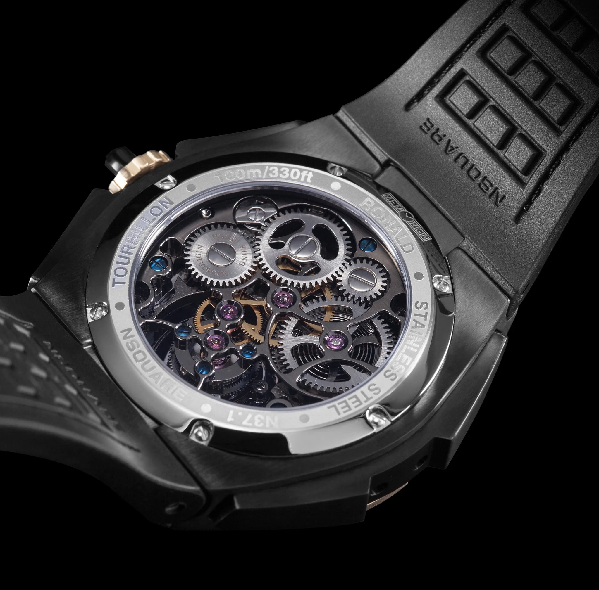 Close-up of a black Tourbillon watch with mechanical components on a black background