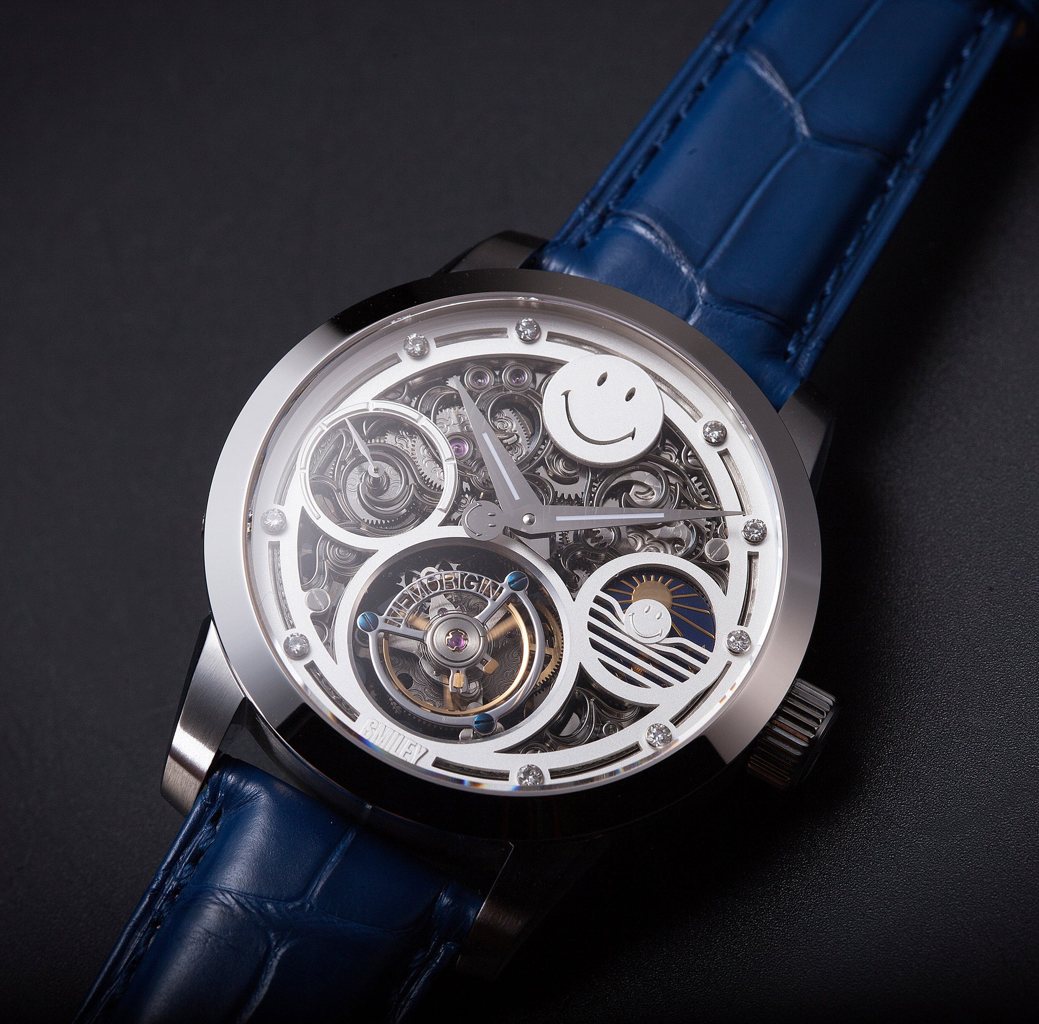 Luxury watch with blue strap and visible mechanical components on a dark background