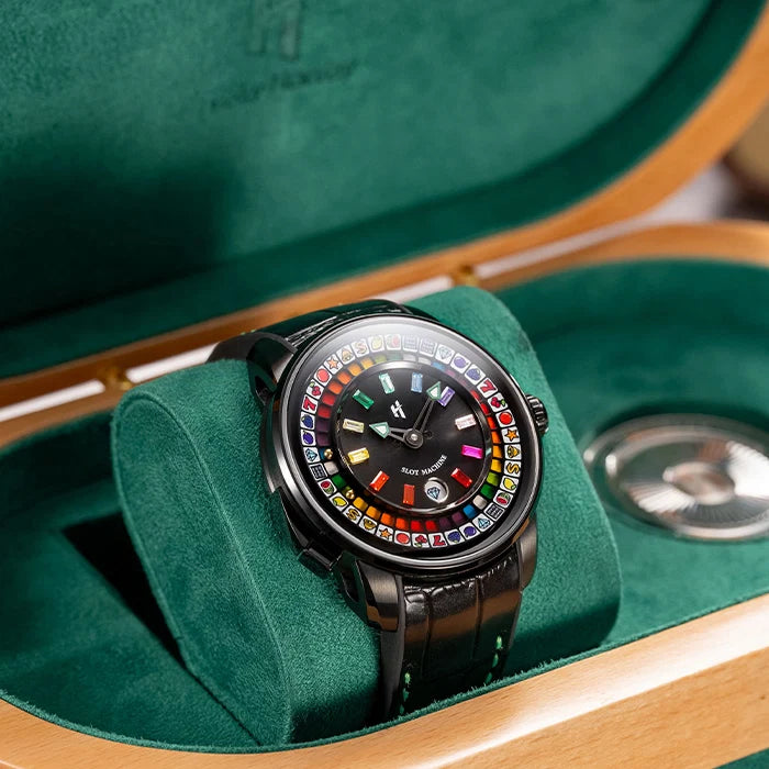 Luxury watch with colorful face on green velvet cushion in open jewelry box