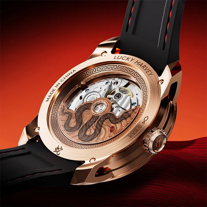 Luxury watch with intricate design on a red background