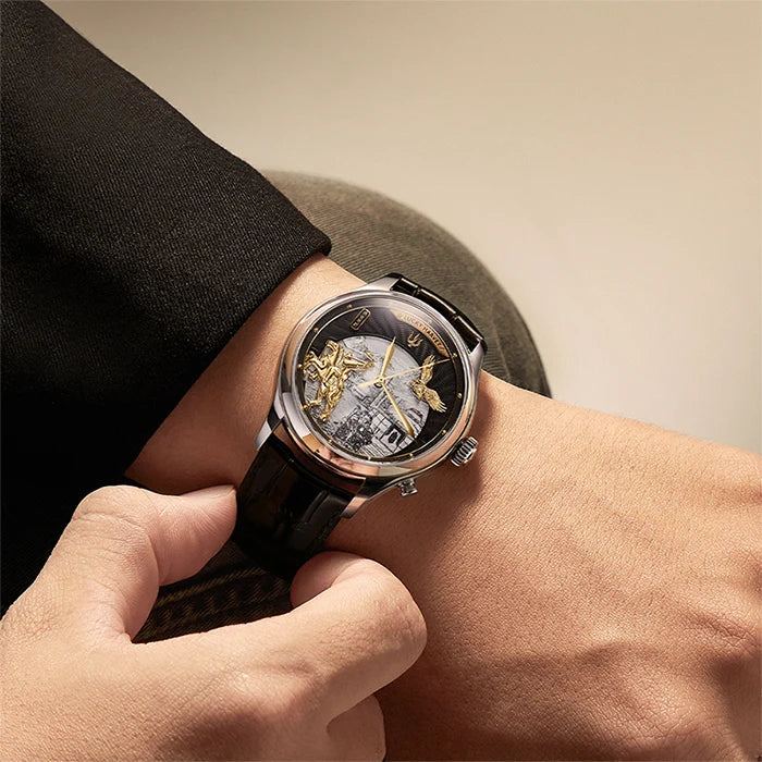 Luxury watch with intricate design on a person's wrist against a neutral background