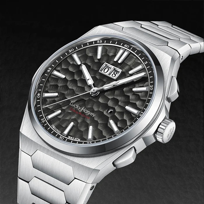Silver wristwatch with a detailed face on a dark background