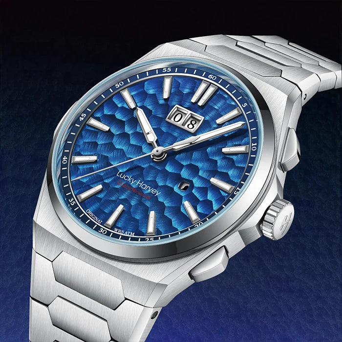 Silver watch with a blue textured face on a dark blue background