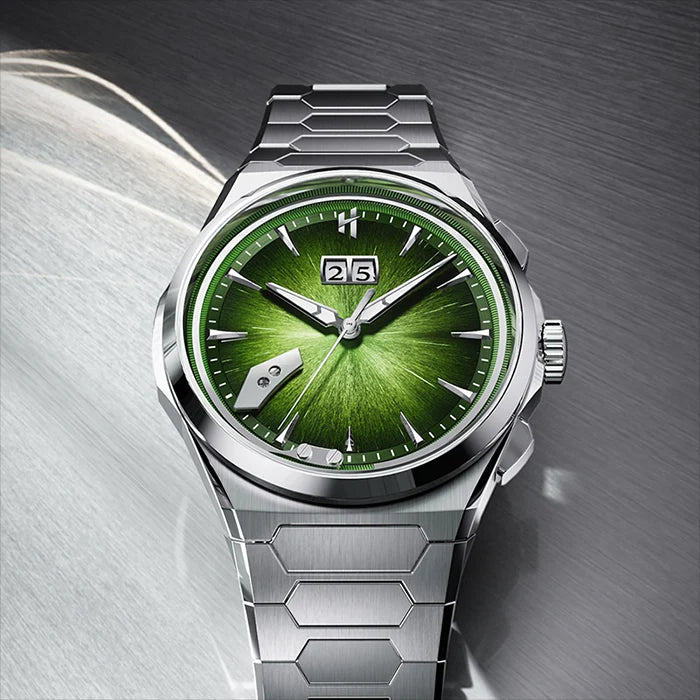 A luxury titanium wristwatch with a vibrant green sunburst dial, silver-toned case, and matching hexagonal link bracelet, shown on a textured gray background.