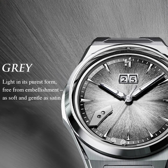 A close-up of a grey-toned stainless steel wristwatch with a textured dial, date window, and silver-toned case on a dark brushed background. Text on the left reads 'GREY' with descriptive copy.