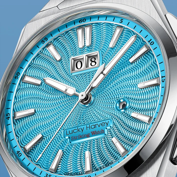 Wristwatch with blue textured dial and silver casing on a blue background
