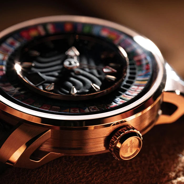 Close-up of a luxurious watch with a detailed face and bronze casing.
