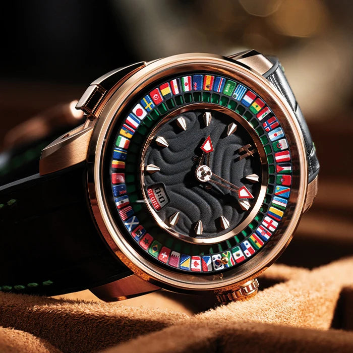 Luxury watch with colorful flag design on a textured surface