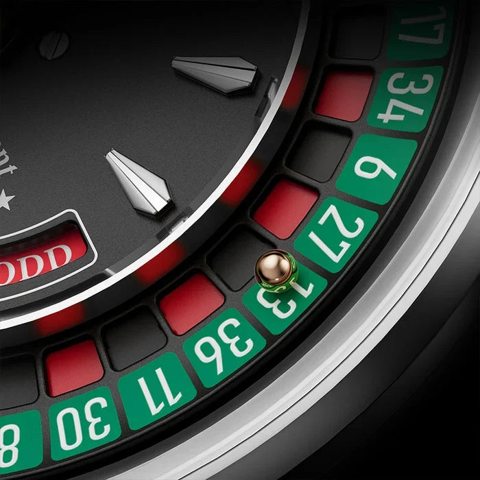 Close-up of a roulette wheel with red and green slots on a black background