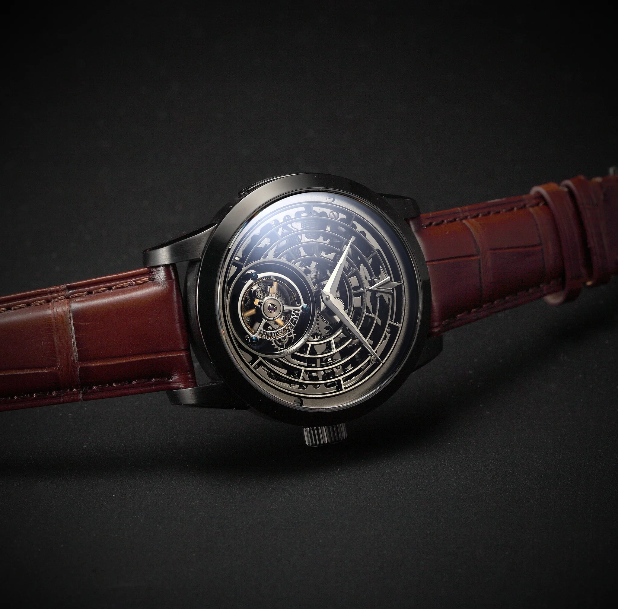 Luxury watch with a brown leather strap on a dark background