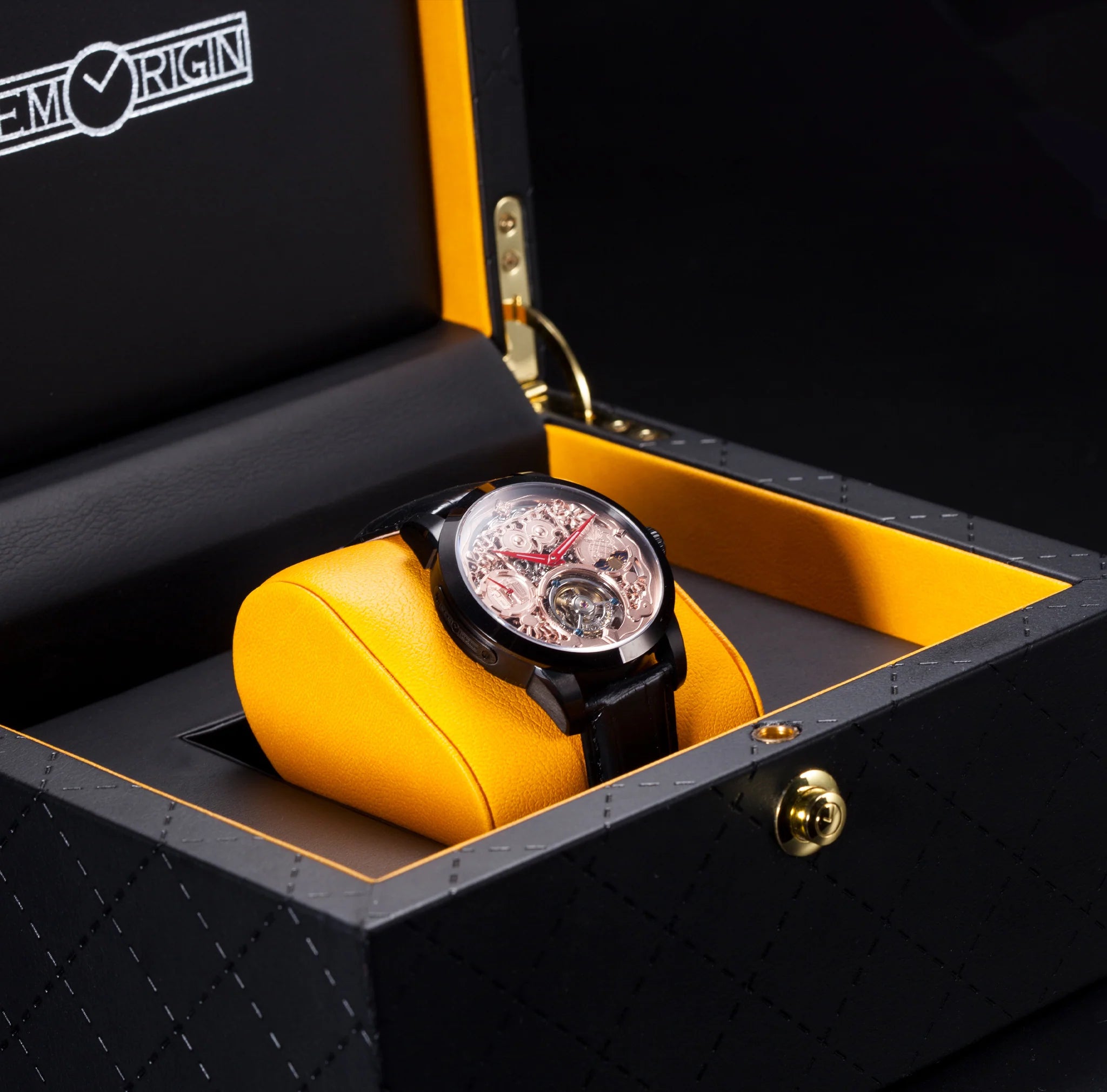 Luxury watch in a black and yellow box with Emorin branding.