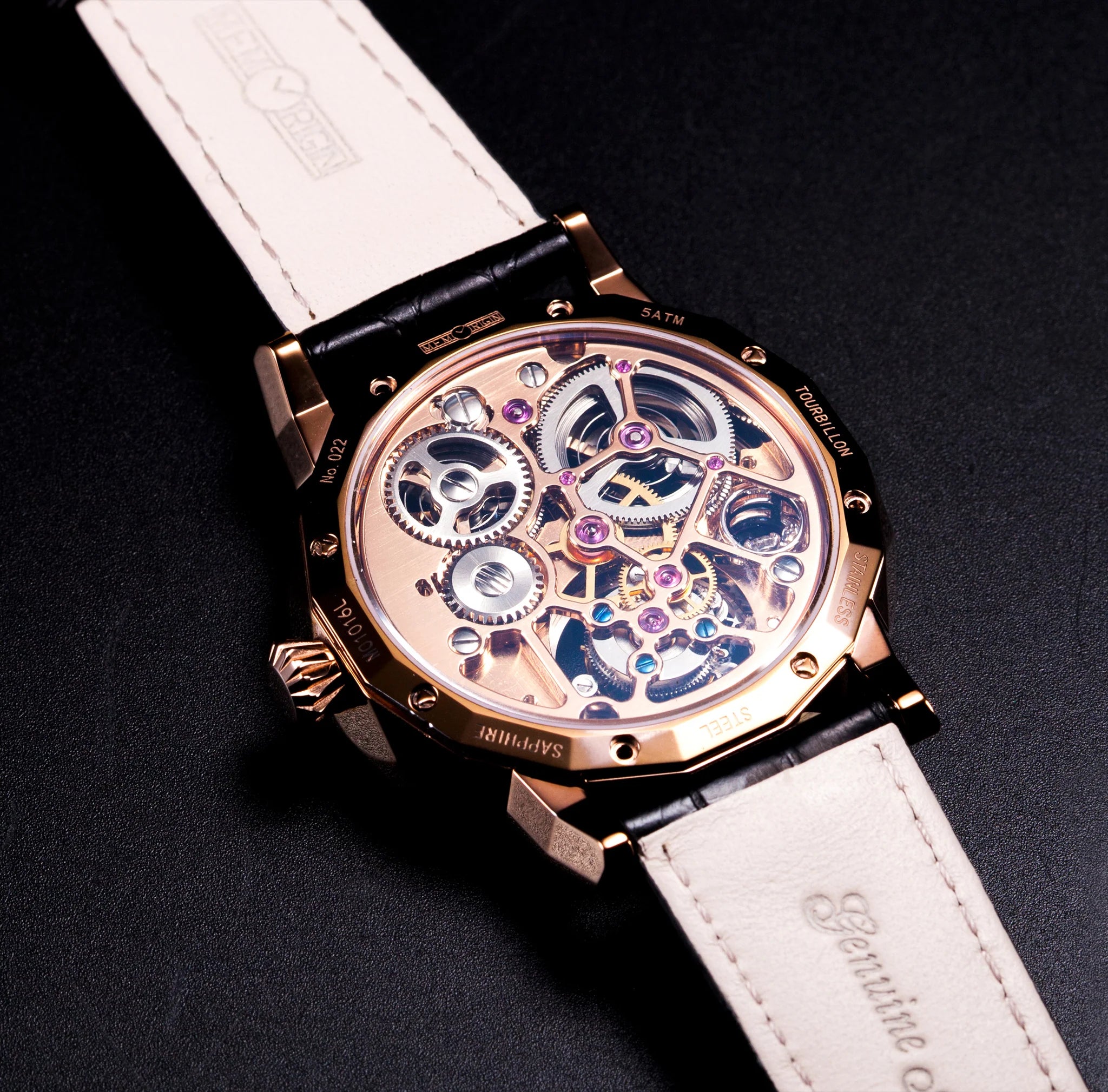 Luxury watch with white leather strap and visible mechanical components on a dark background