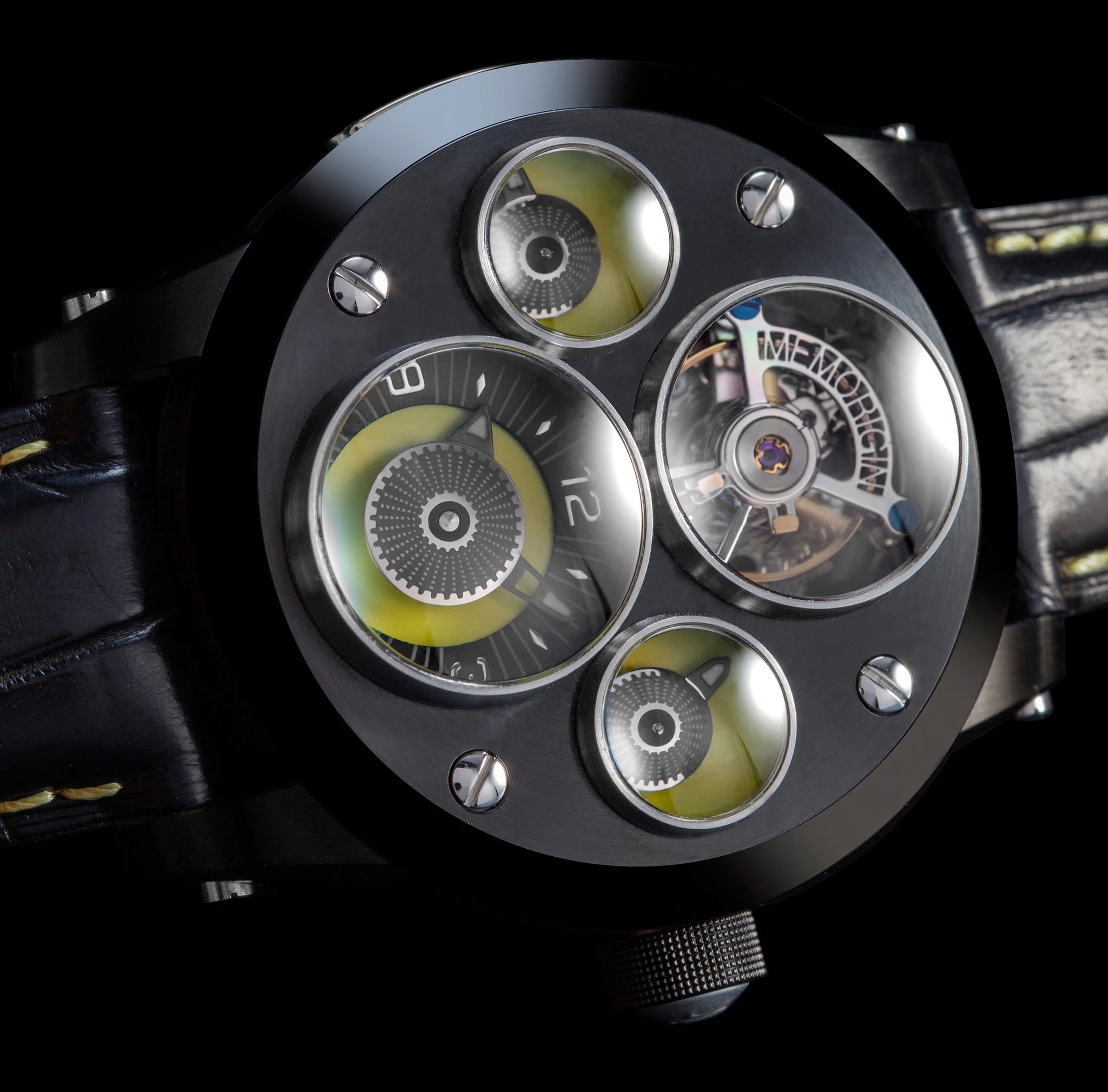 Close-up of a mechanical watch with visible brand name on a black background