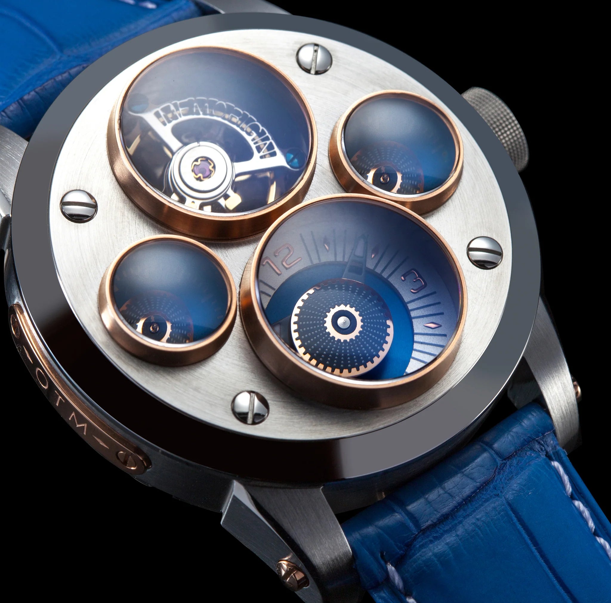 Close-up of a detailed watch with blue and silver design on a black background
