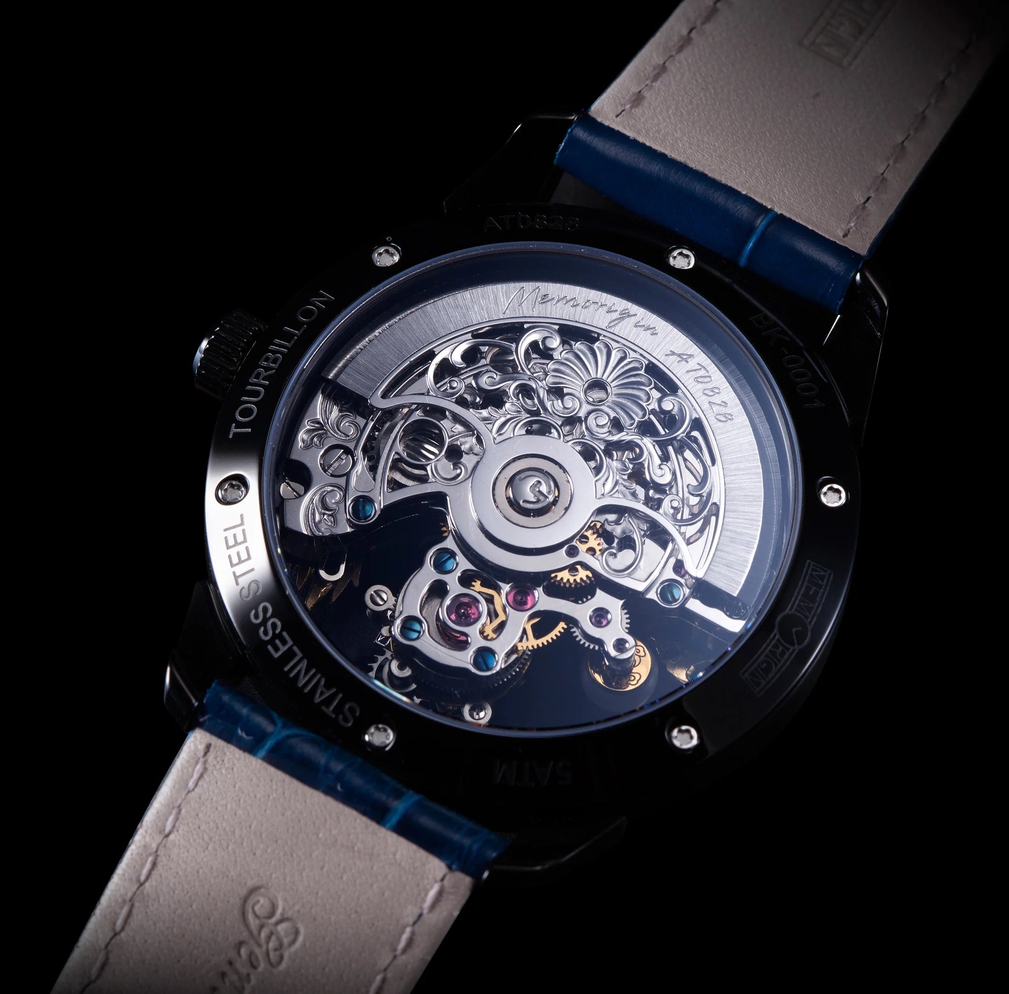 Watch with a transparent caseback revealing mechanical components on a dark background
