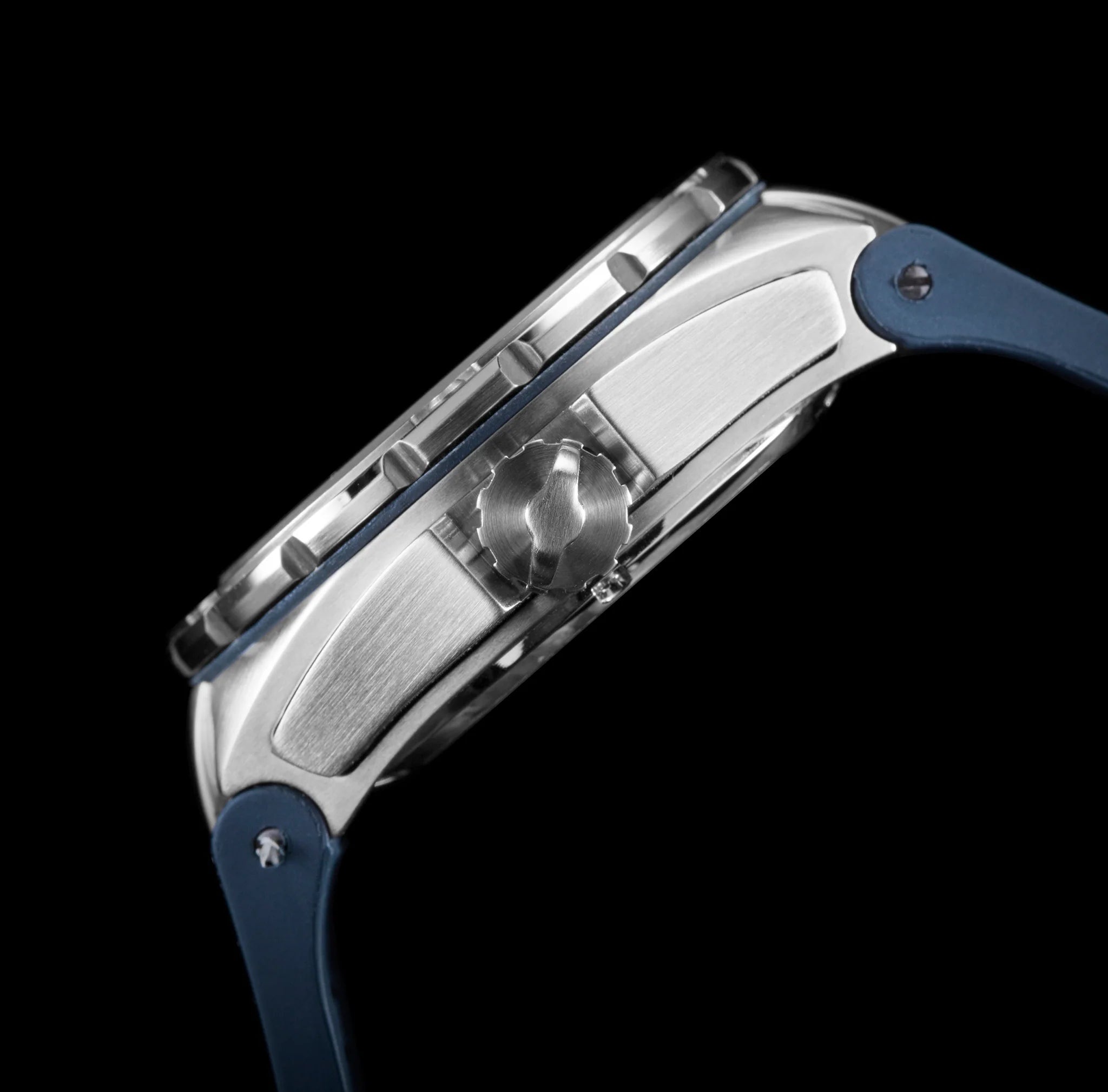 Close-up of a watch with a blue strap and metallic case on a black background