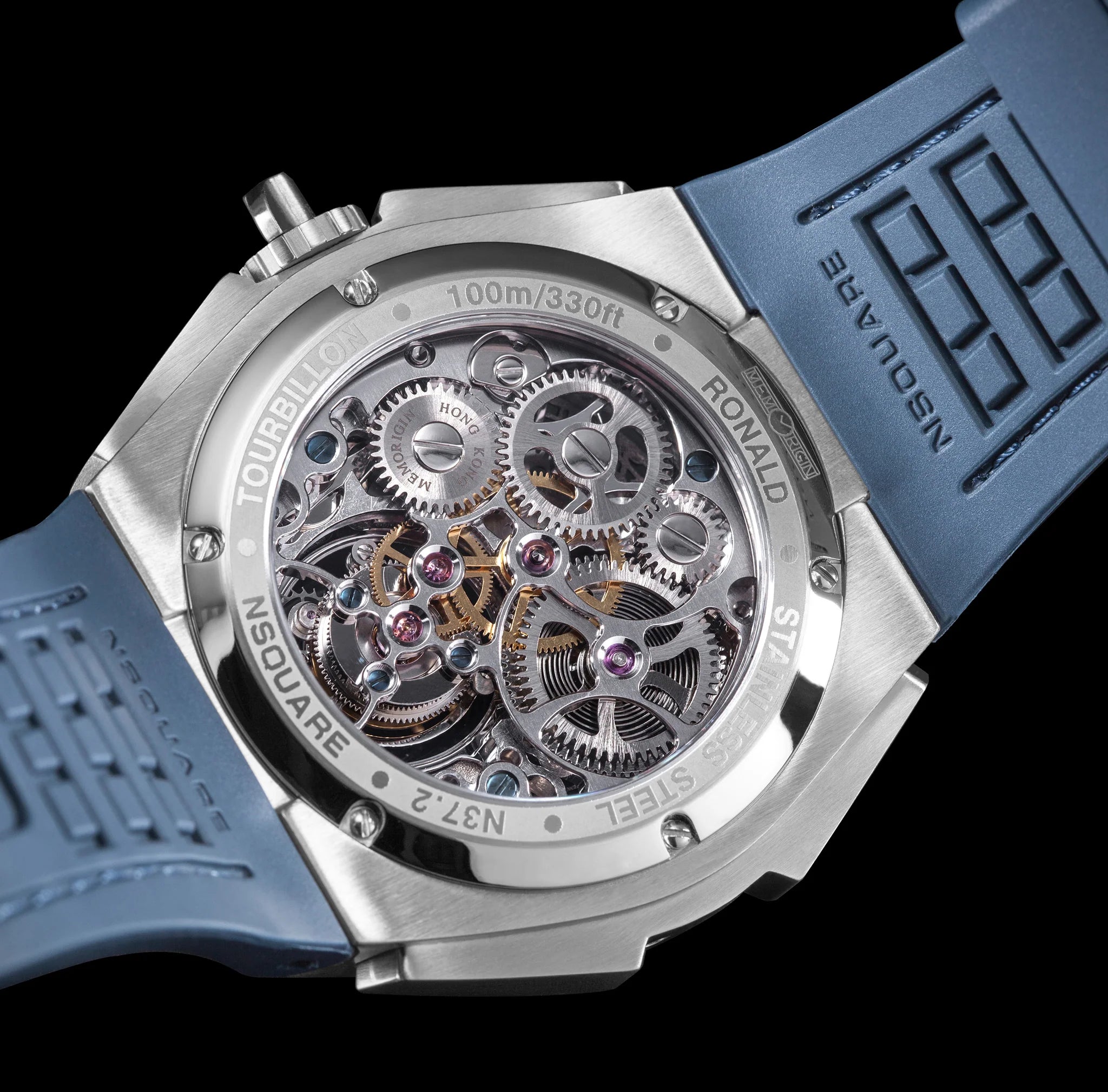 Watch with blue strap and visible mechanical components on a black background