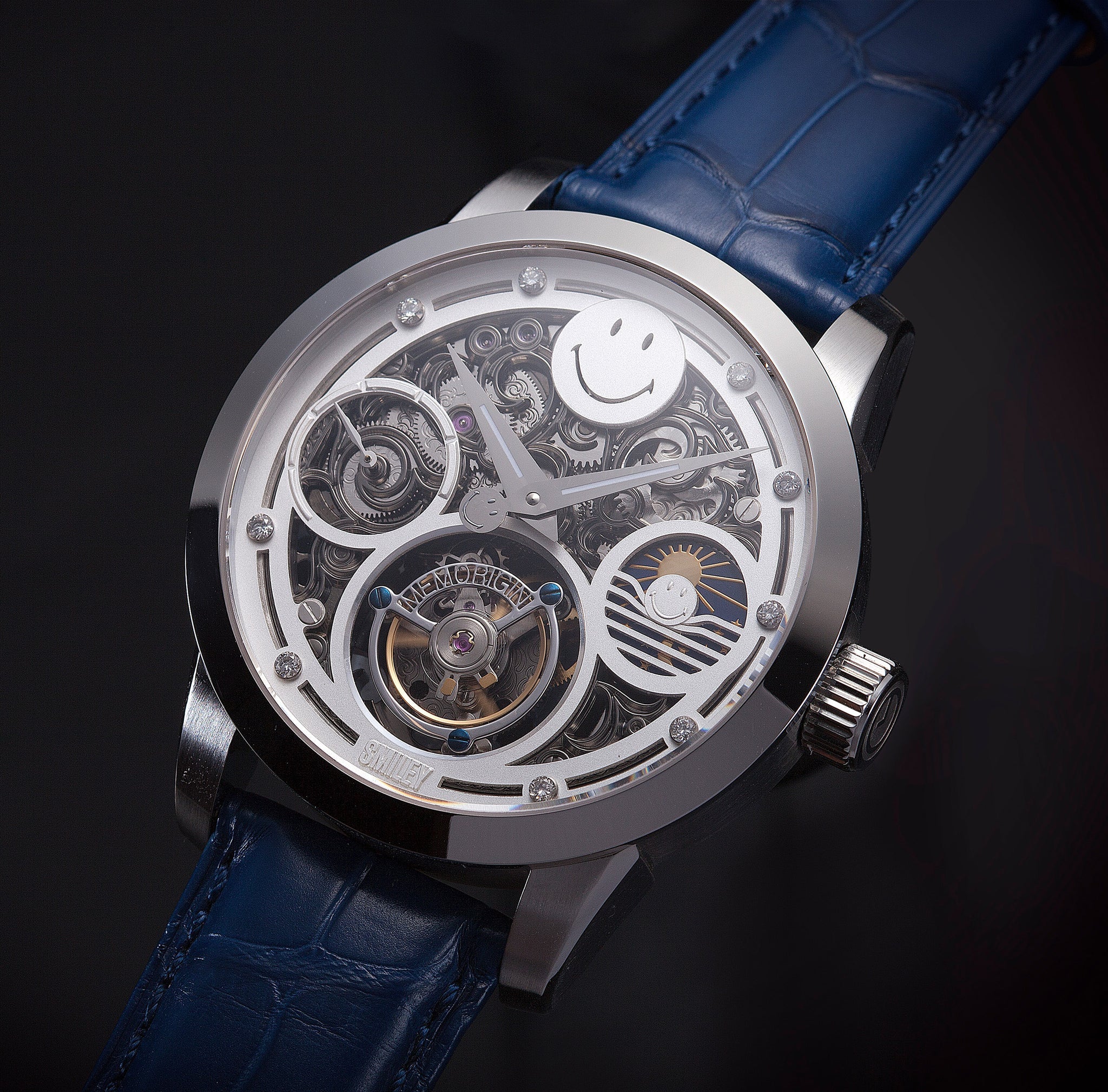 Luxury watch with blue strap and intricate mechanical design on a dark background