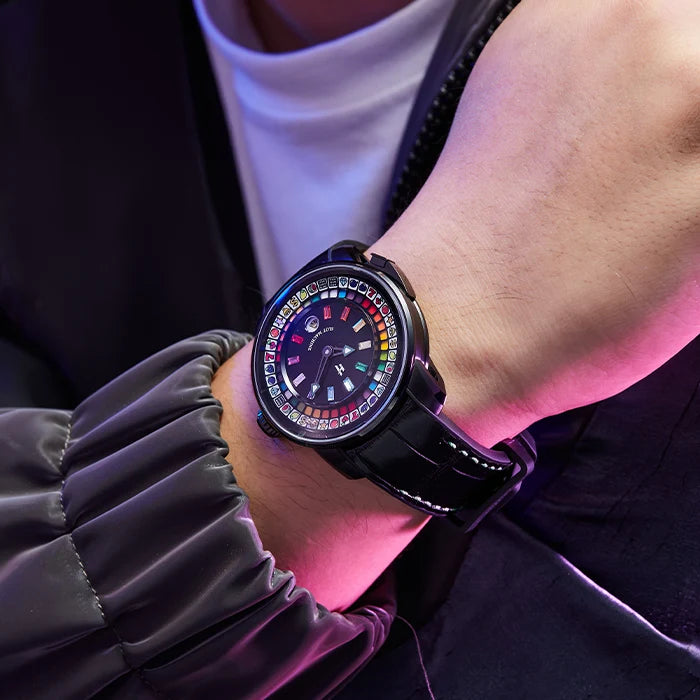 Person wearing a smartwatch with a colorful display on a dark background