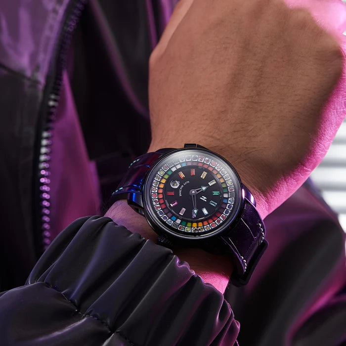 Close-up of a person's wrist wearing a colorful watch with a vibrant background.