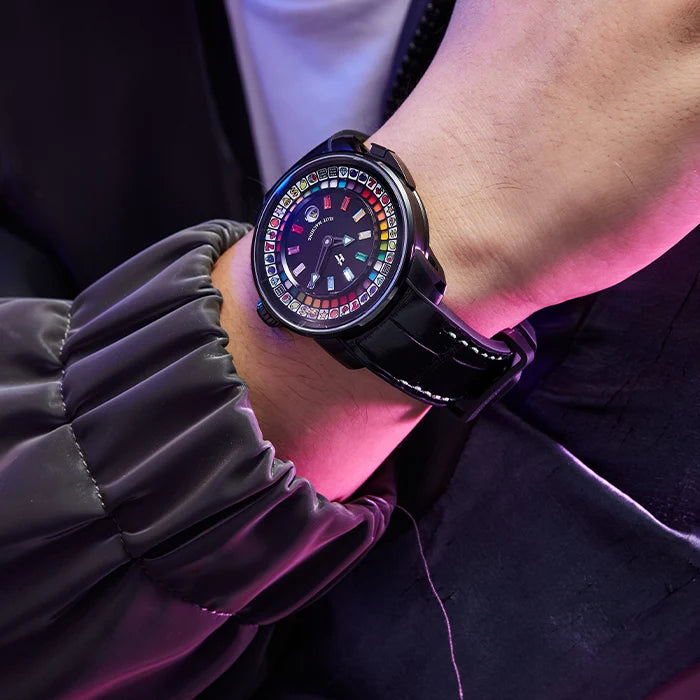 Close-up of a person wearing a smartwatch with a colorful display.