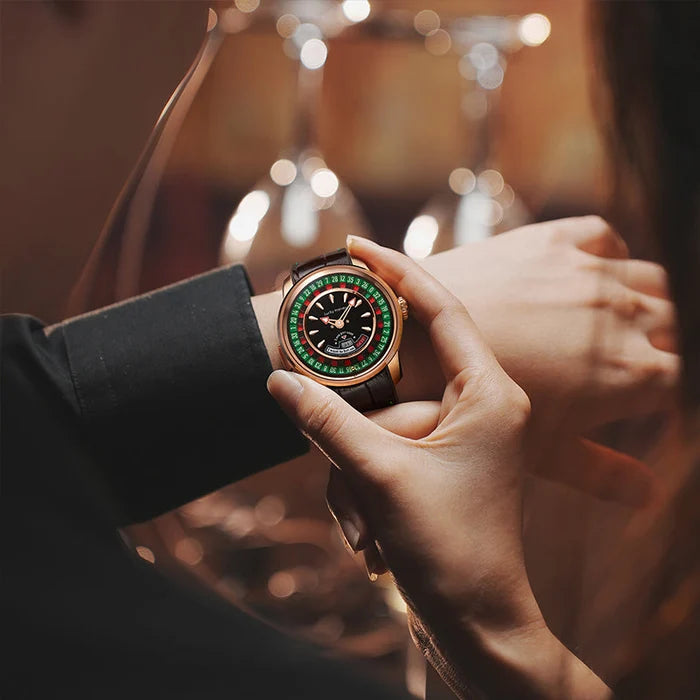 Close-up of a person adjusting a green wristwatch with a blurred background