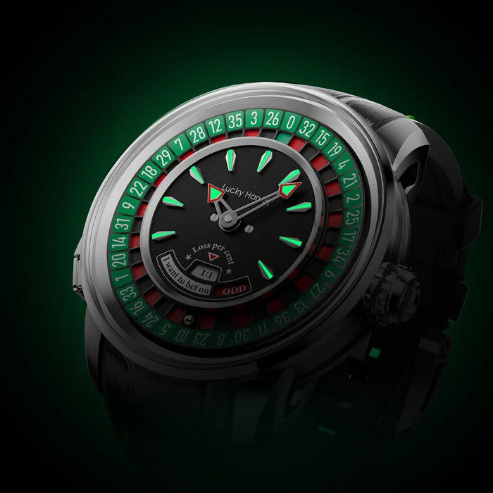 A close-up studio shot of a Lucky Hoop watch with a black dial, green and red roulette-style outer ring, and a dark translucent strap, set against a dark green background.