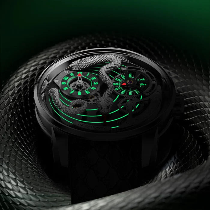 Close-up of a black wristwatch with green glowing details, coiled on a dark background.