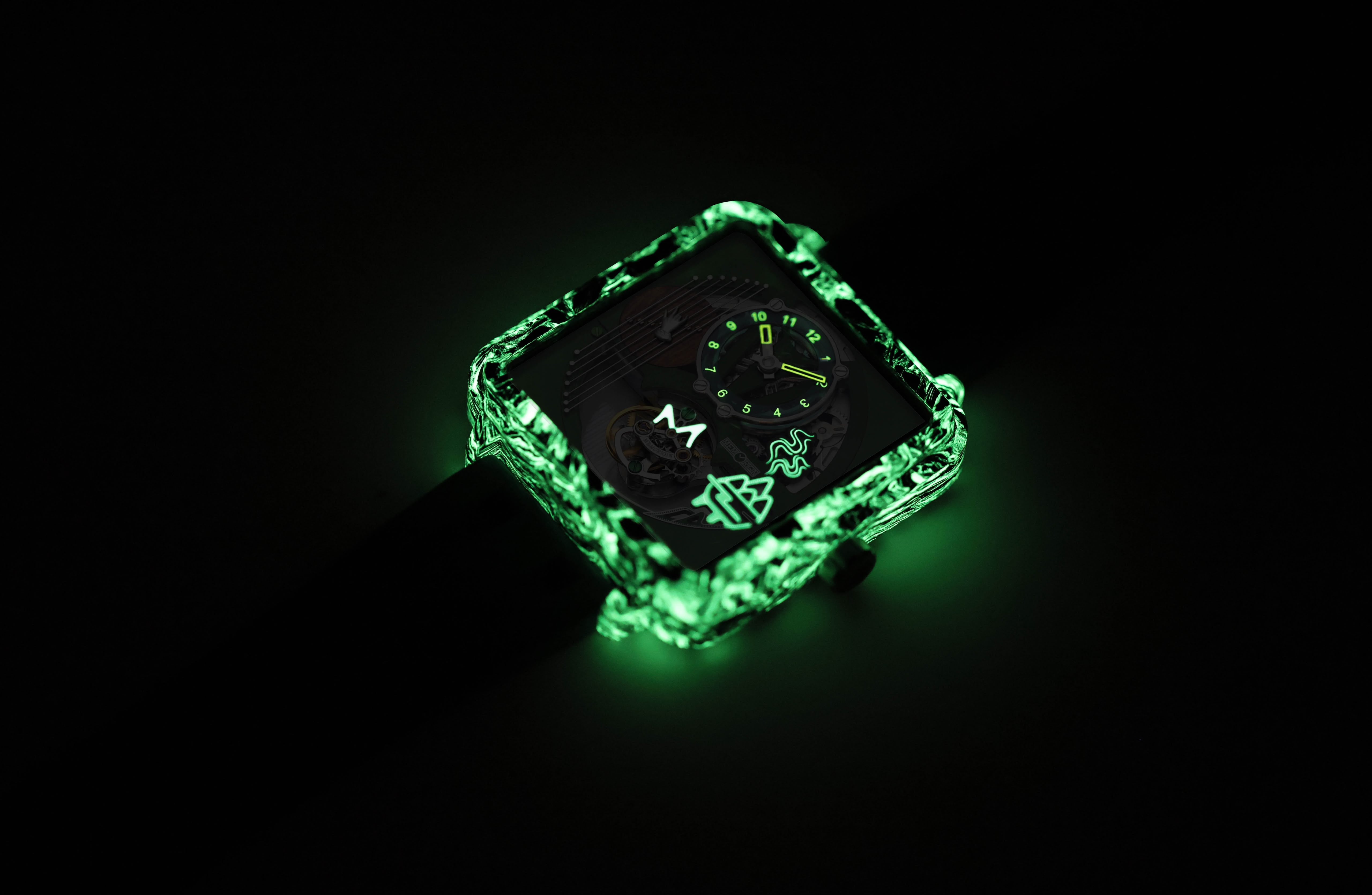 A tourbillon watch from Memorigin with a glowing green translucent case and dark dial, photographed against a black background.