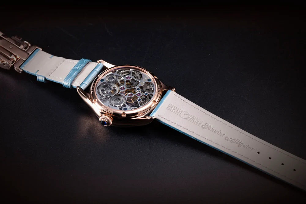 Watch with a blue strap on a dark background