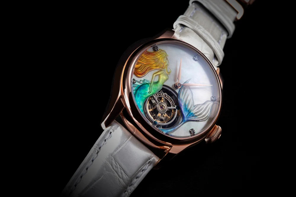 Luxury watch with artistic face and white strap on black background