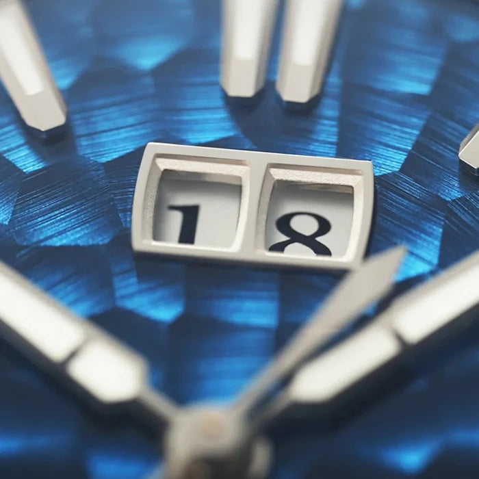 Close-up of a clock face with the number 18 on a blue textured background