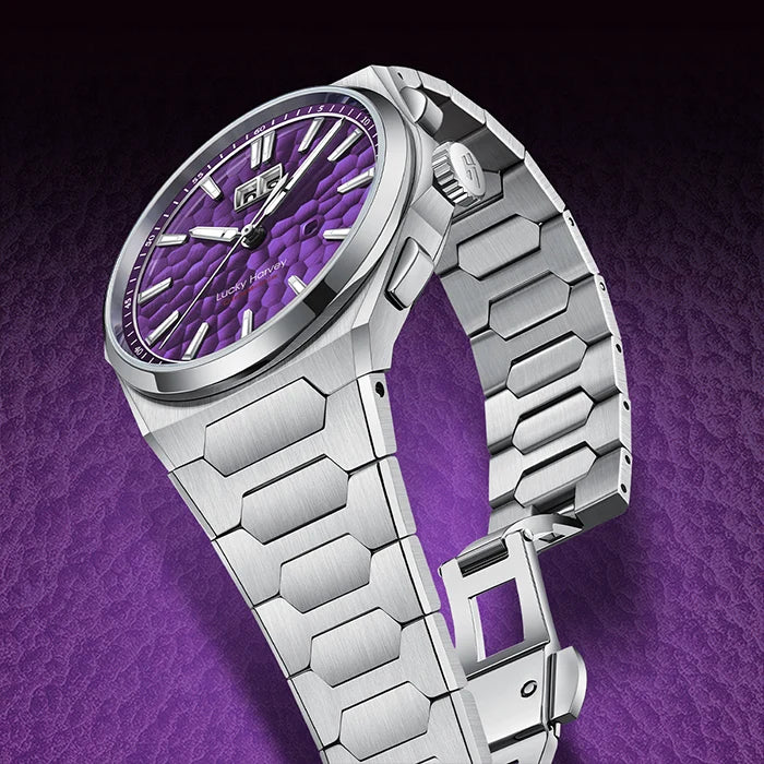 Silver watch with a purple face on a purple background
