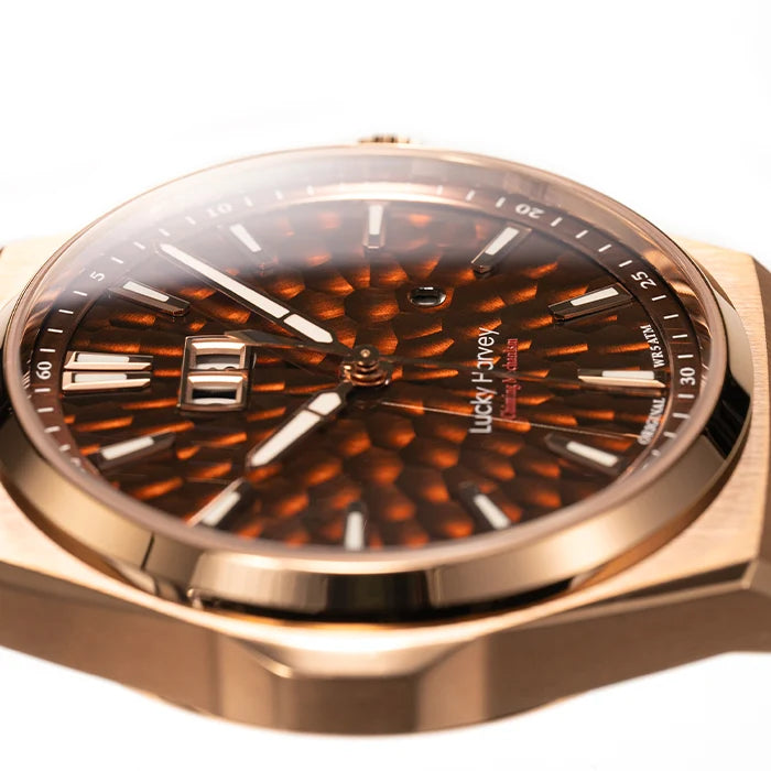 Close-up of a Lucky 7-jew wristwatch with a rose gold-toned case and a textured brown dial featuring a sunburst pattern and date window.