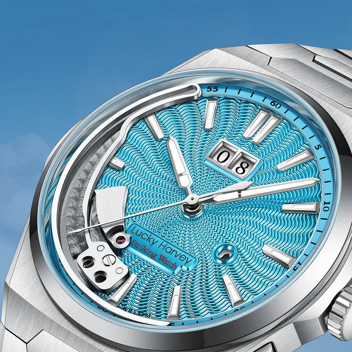 Silver watch with a blue textured face on a clear background