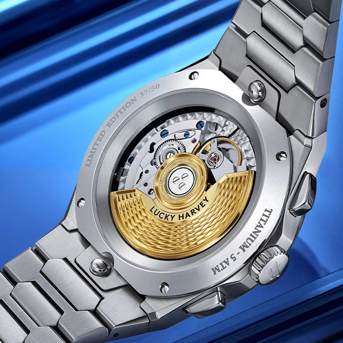 Close-up of a silver and gold watch with 'Lucky Harvey' branding on a blue background