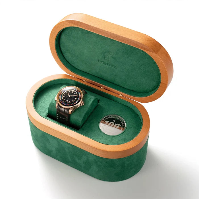 Watch in a green and wooden box on a white background