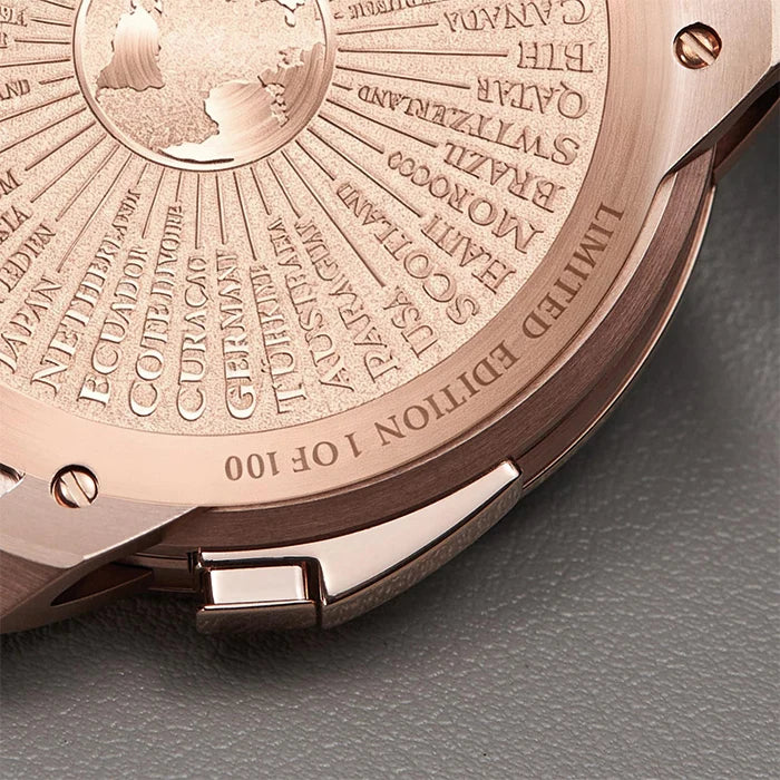 Close-up of the back of a rose gold watch, showing engraved country names radiating from a central map design, with text reading 'LIMITED EDITION 1 OF 100'.