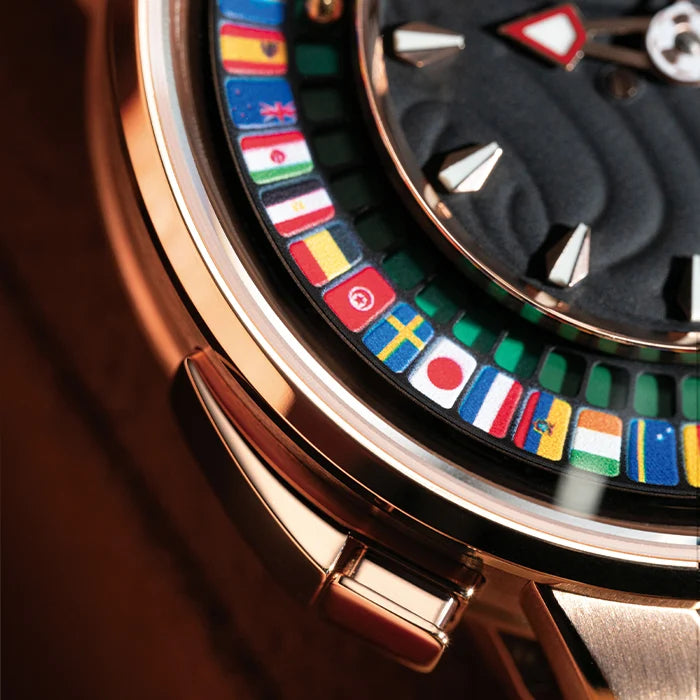 Close-up of a watch with a colorful flag disc rotor and rose gold case.